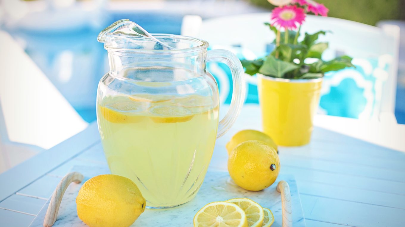 Limoncello and lemons in a jug