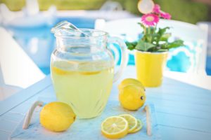 Limoncello and lemons in a jug